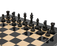 Luxury Staunton competition chess set with black pieces on chessboard.